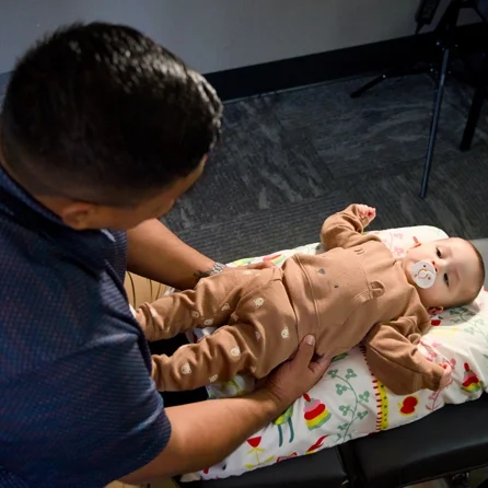 Christopher Moore Adjusting A Baby