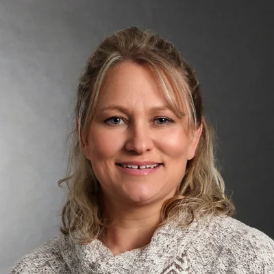 Jolene Laughlin smiling, she has blonde hair.